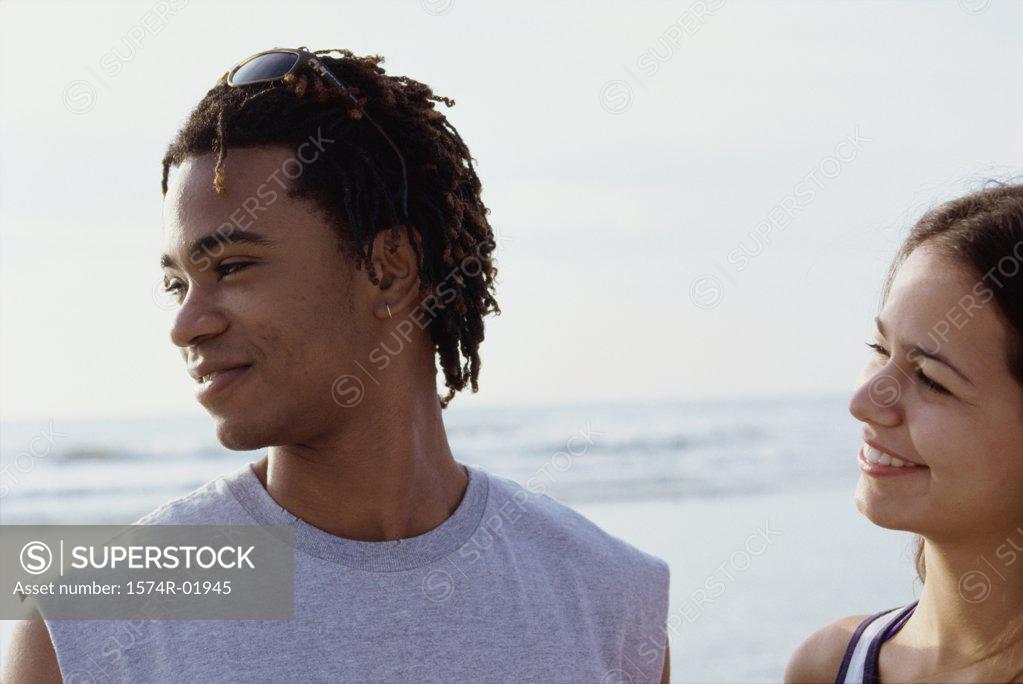 Stock Photo: 1574R-01945 Close-up of a young couple at the beach