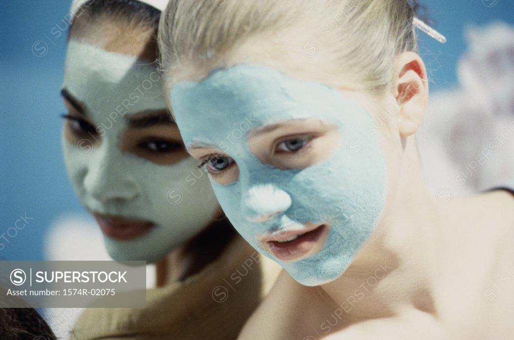 Stock Photo: 1574R-02075 Close-up of two teenage girls wearing facial masks