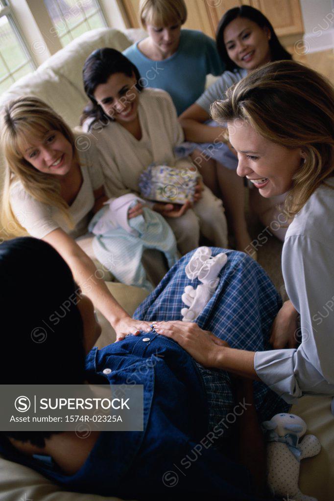 Stock Photo: 1574R-02325A Group of young women sitting together at a baby shower