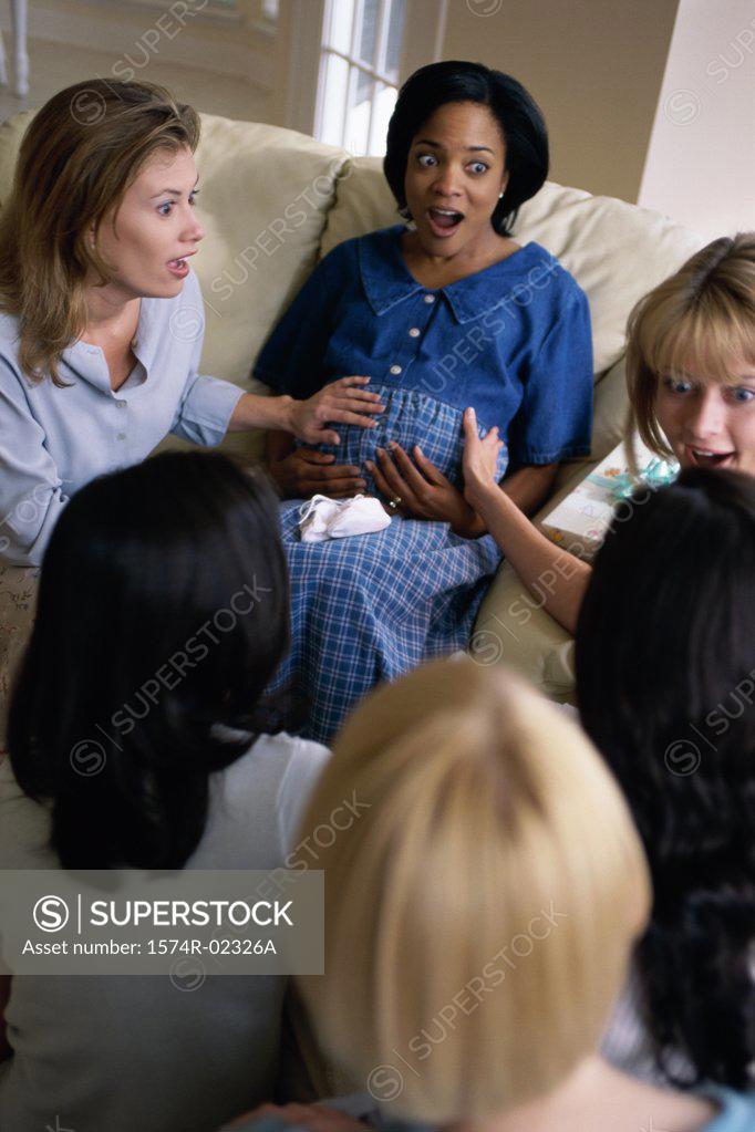 Stock Photo: 1574R-02326A Group of young women sitting together at a baby shower