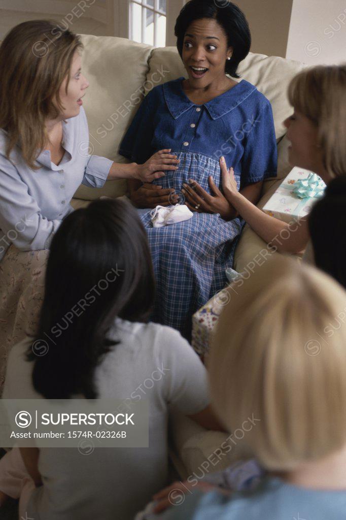 Stock Photo: 1574R-02326B Group of young women sitting together at a baby shower