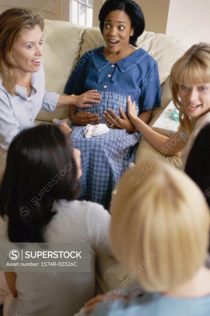 Stock Photo: 1574R-02326C Group of young women sitting together at a baby shower