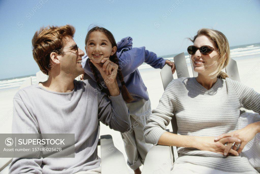 Stock Photo: 1574R-02562B Parents with their daughter on the beach