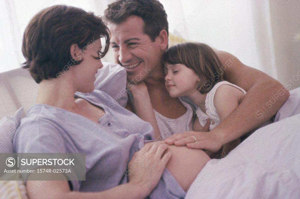 Stock Photo: 1574R-02573A Pregnant woman with her husband and her daughter