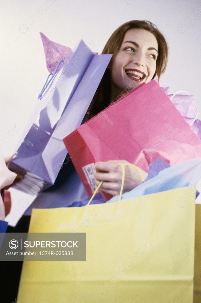 Stock Photo: 1574R-02588B Young woman carrying shopping bags