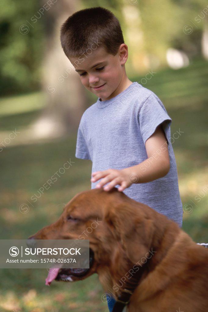 Stock Photo: 1574R-02637A Boy petting his dog