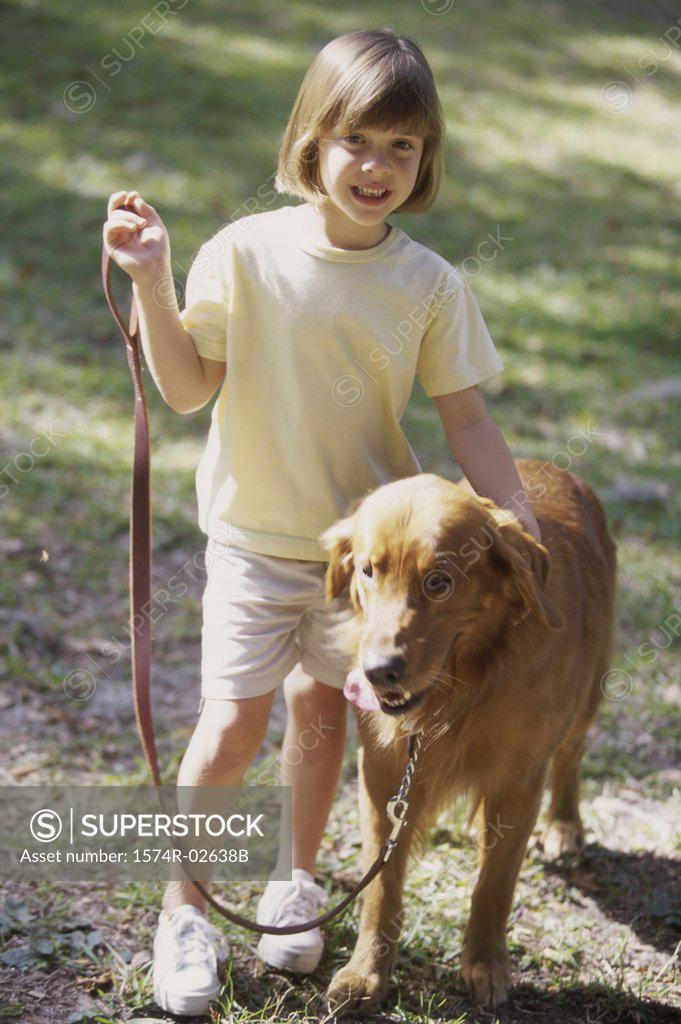 Stock Photo: 1574R-02638B Girl standing with her dog