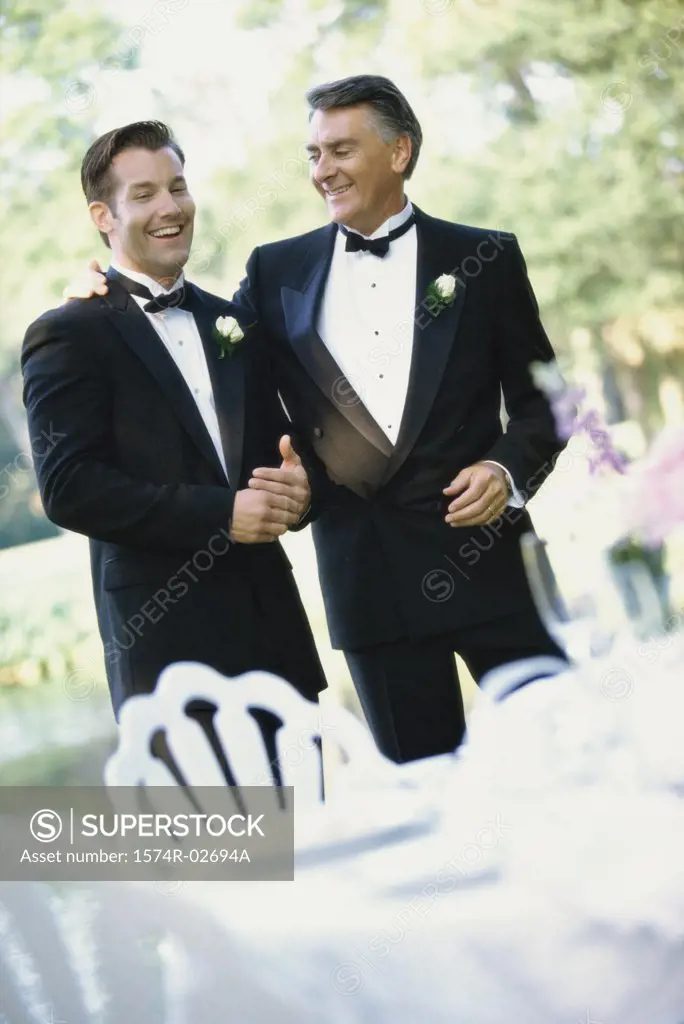 Newlywed young man talking with his father