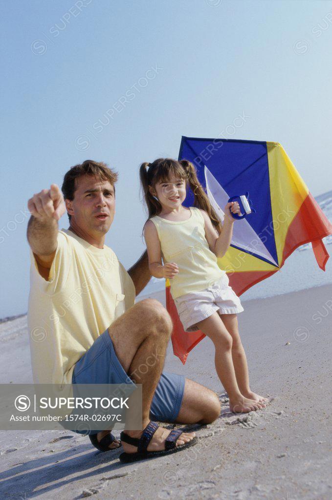 Stock Photo: 1574R-02697C Father and his daughter on the beach