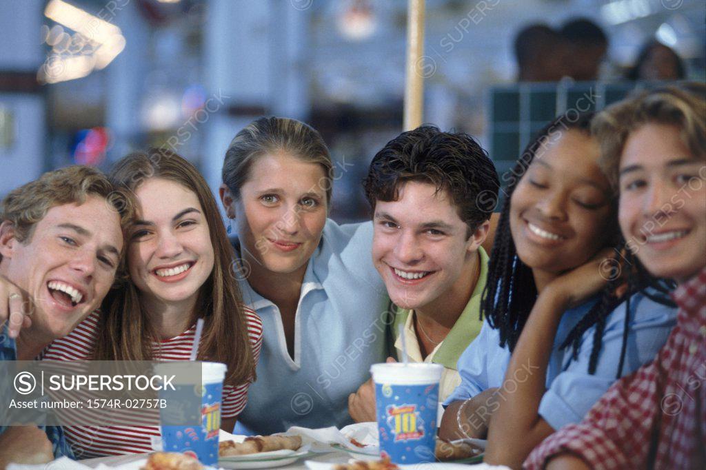 Stock Photo: 1574R-02757B Portrait of a group of teenagers sitting in a restaurant