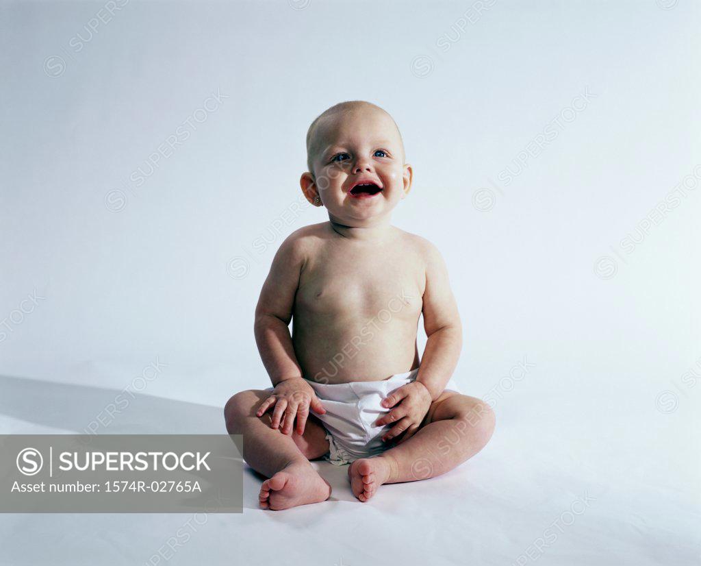 Stock Photo: 1574R-02765A Baby boy sitting and smiling