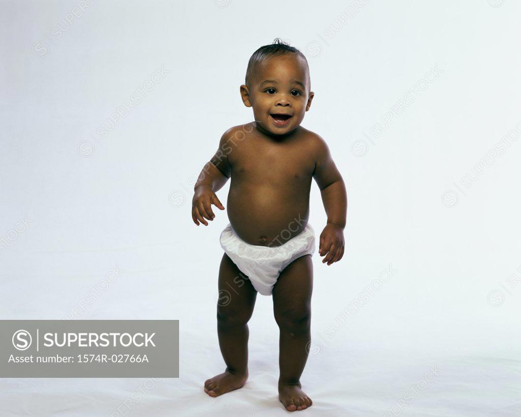 Stock Photo: 1574R-02766A Baby boy standing and smiling