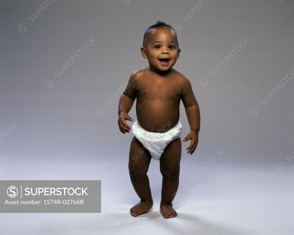 Stock Photo: 1574R-02766B Baby boy trying to walk
