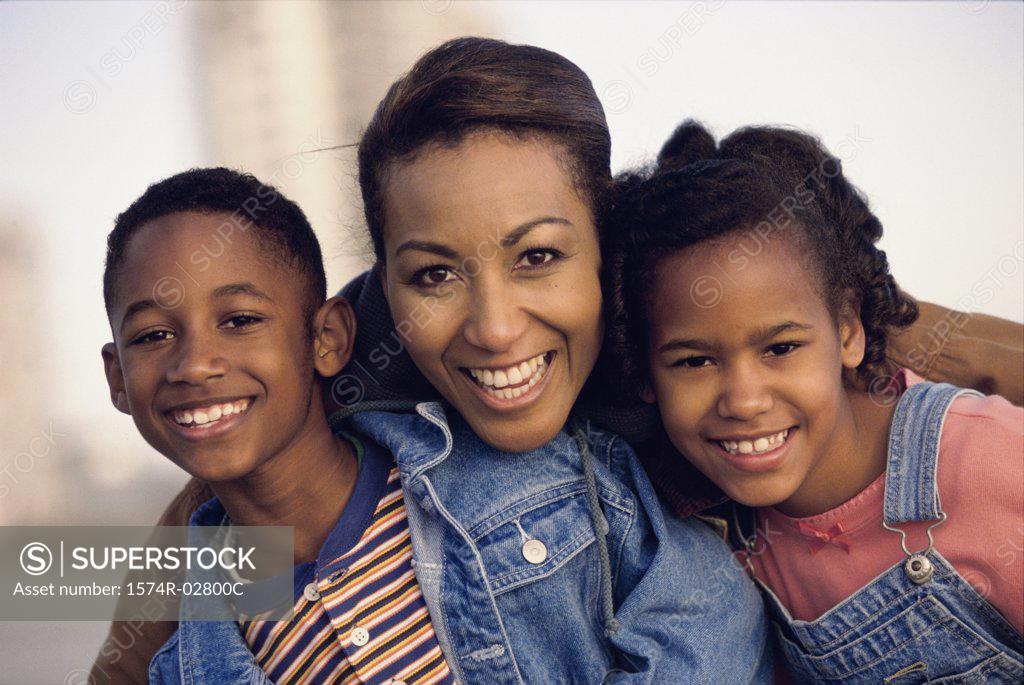 Stock Photo: 1574R-02800C Portrait of a mother smiling with her son and daughter