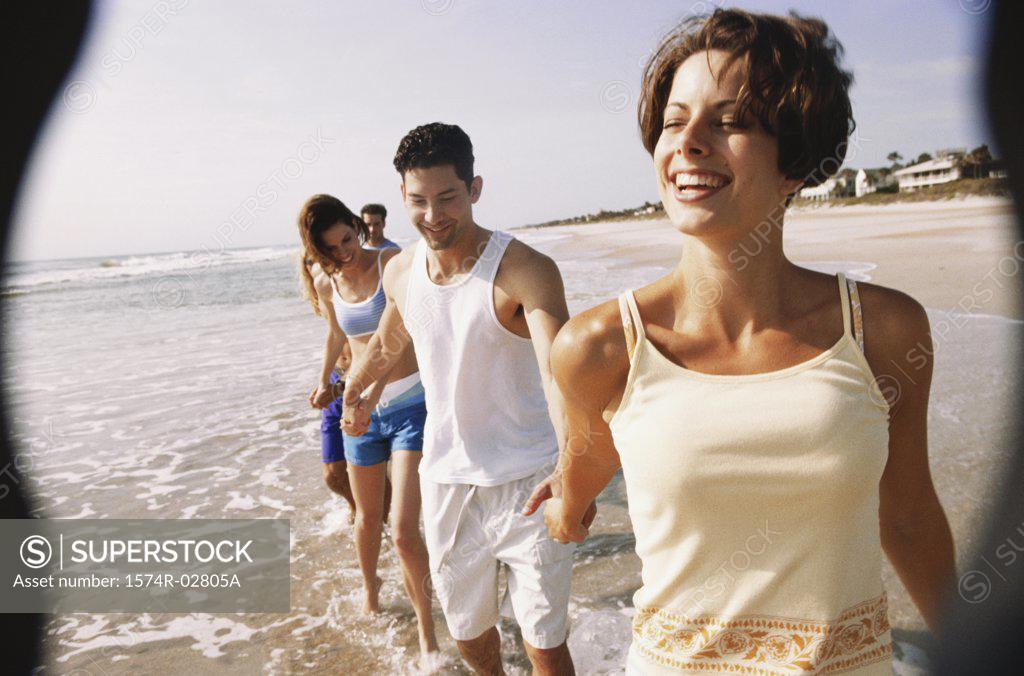 Stock Photo: 1574R-02805A Young couples walking while holding hands