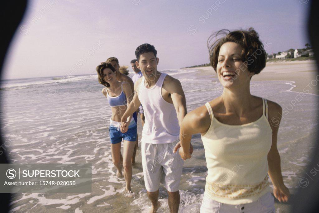 Stock Photo: 1574R-02805B Young couples walking while holding hands