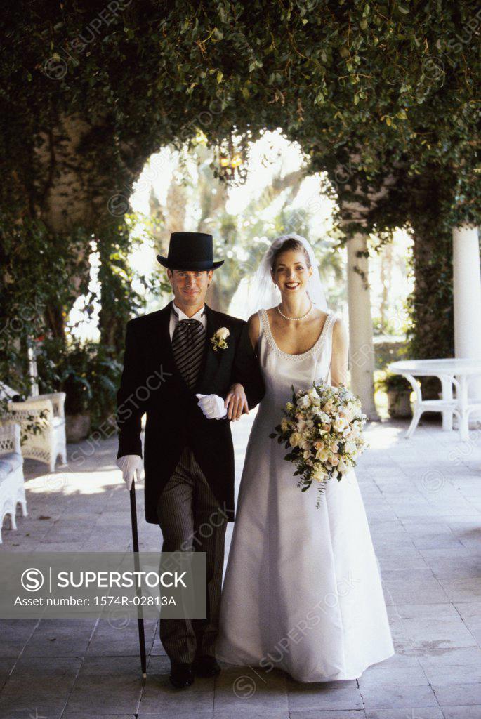 Stock Photo: 1574R-02813A Portrait of a newlywed couple walking