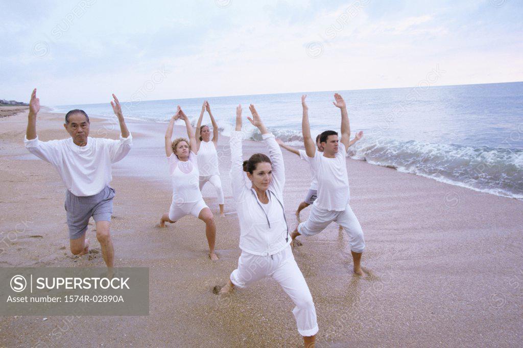 Stock Photo: 1574R-02890A Group of people exercising on the beach