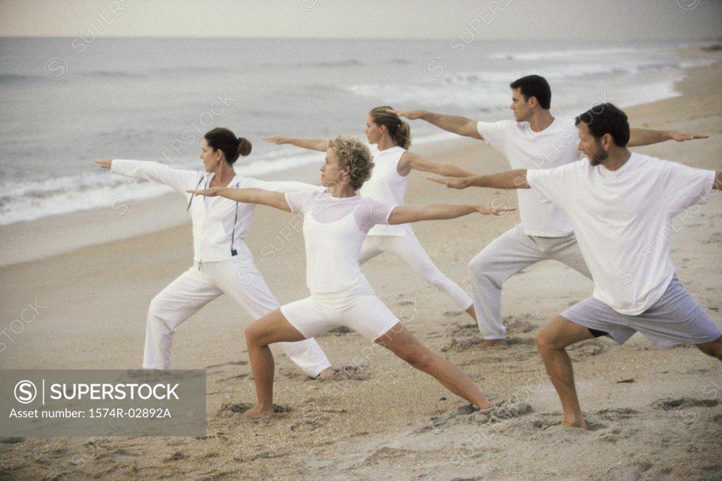 Stock Photo: 1574R-02892A Group of people exercising on the beach