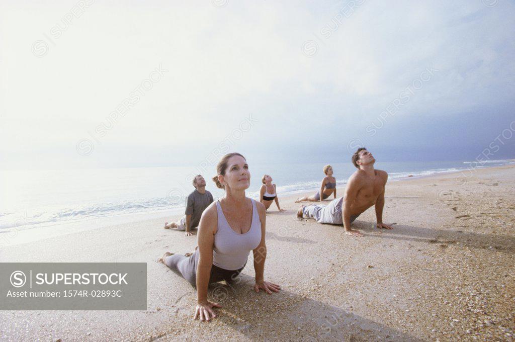 Stock Photo: 1574R-02893C Group of people exercising on the beach