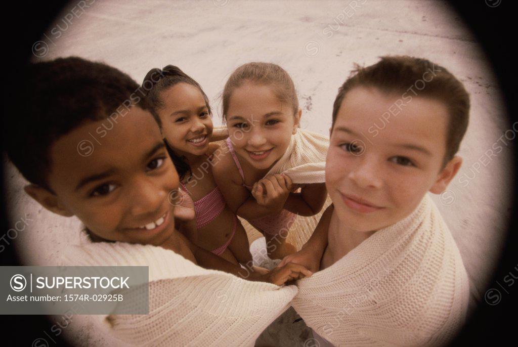 Stock Photo: 1574R-02925B Portrait of a group of children standing together on the beach