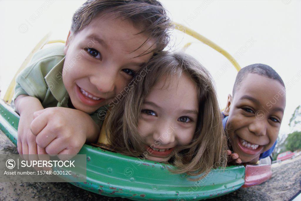 Stock Photo: 1574R-03012C Portrait of two boys and a girl playing