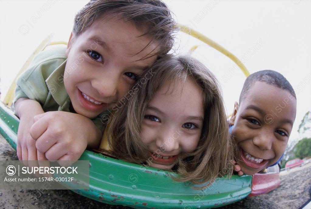 Stock Photo: 1574R-03012F Portrait of two boys and a girl playing
