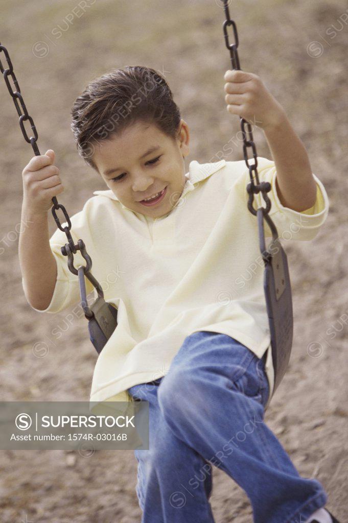 Stock Photo: 1574R-03016B Boy sitting on a swing