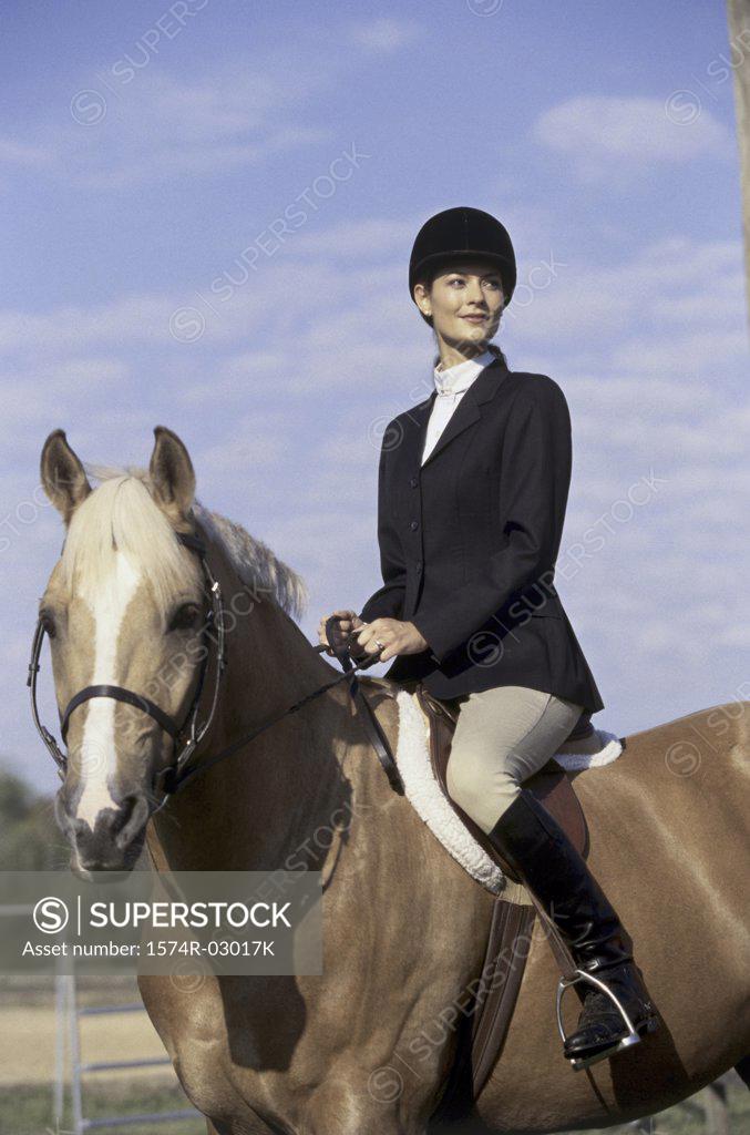 Stock Photo: 1574R-03017K Jockey sitting on a horse