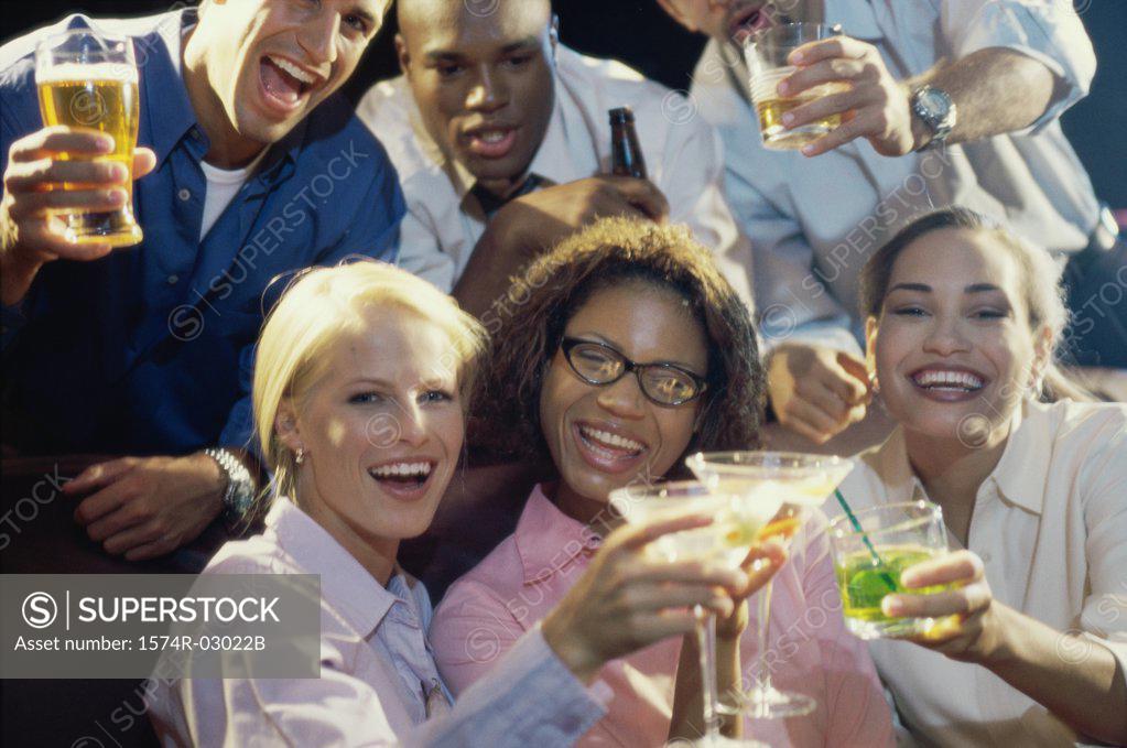 Stock Photo: 1574R-03022B Portrait of three young couples toasting with glasses