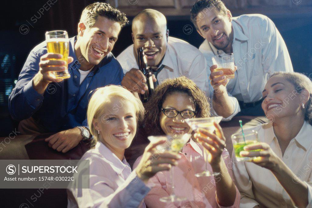 Stock Photo: 1574R-03022C Portrait of three young couples toasting with glasses