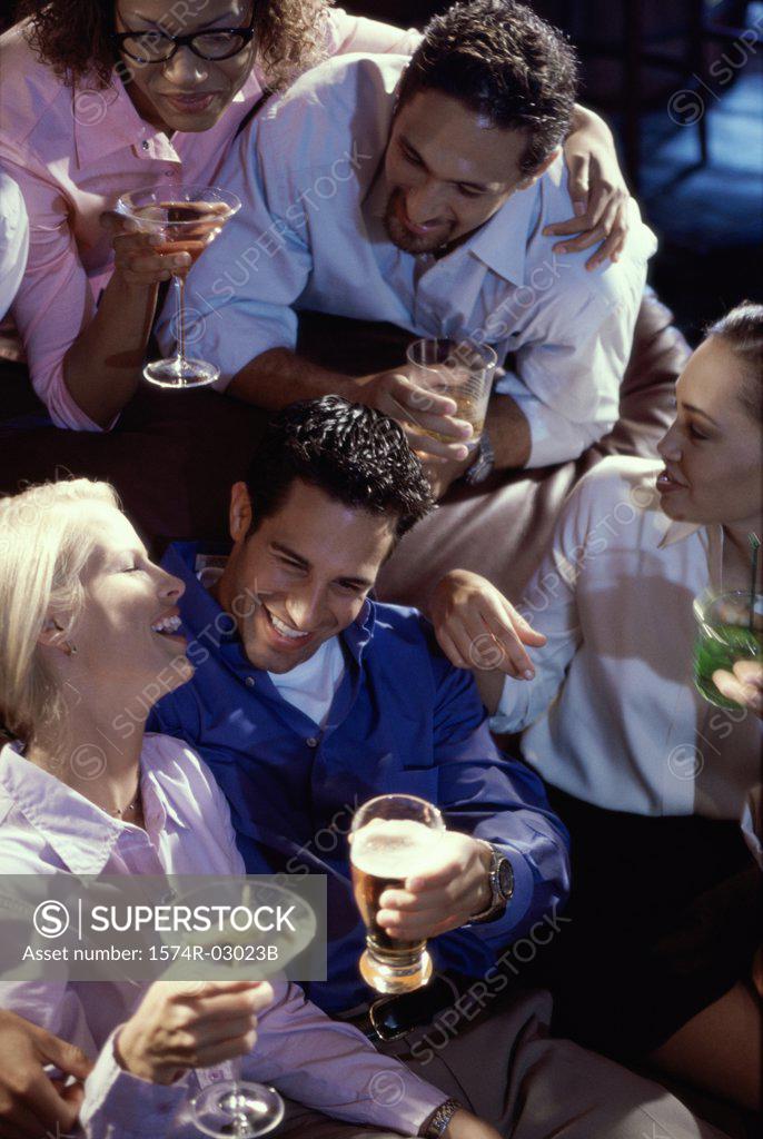 Stock Photo: 1574R-03023B Group of young people in a bar