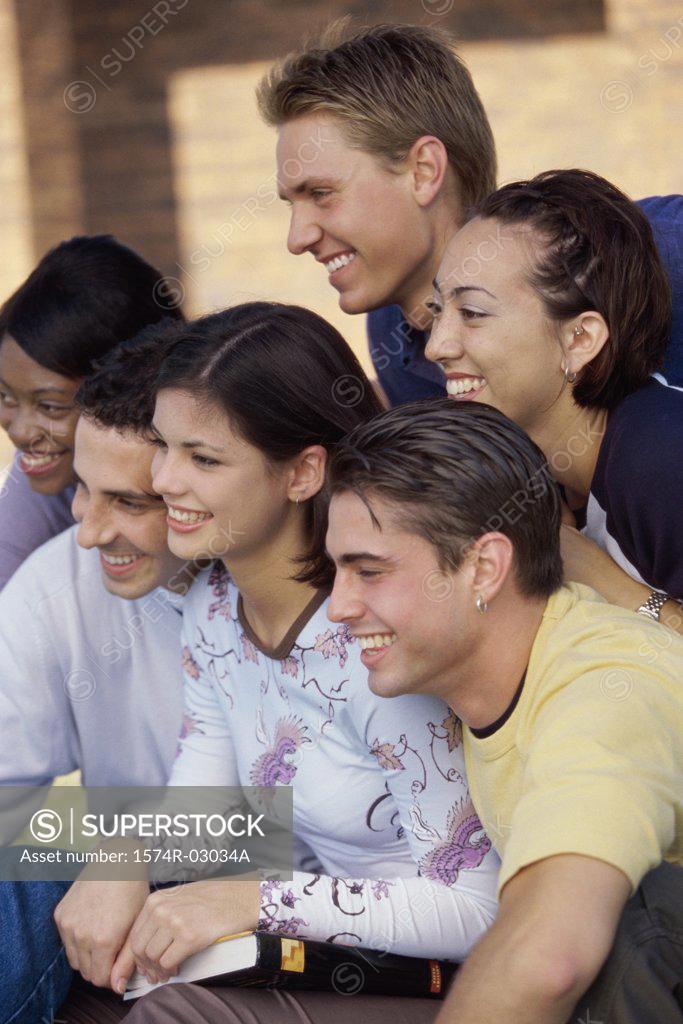 Stock Photo: 1574R-03034A Side profile of a group of teenagers smiling