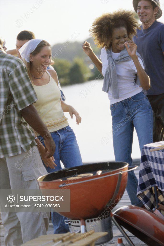 Stock Photo: 1574R-03035B Group of young people at a barbecue