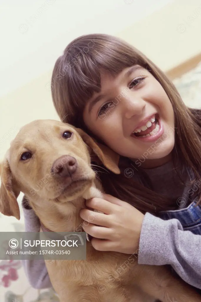 Close-up of a girl holding her dog