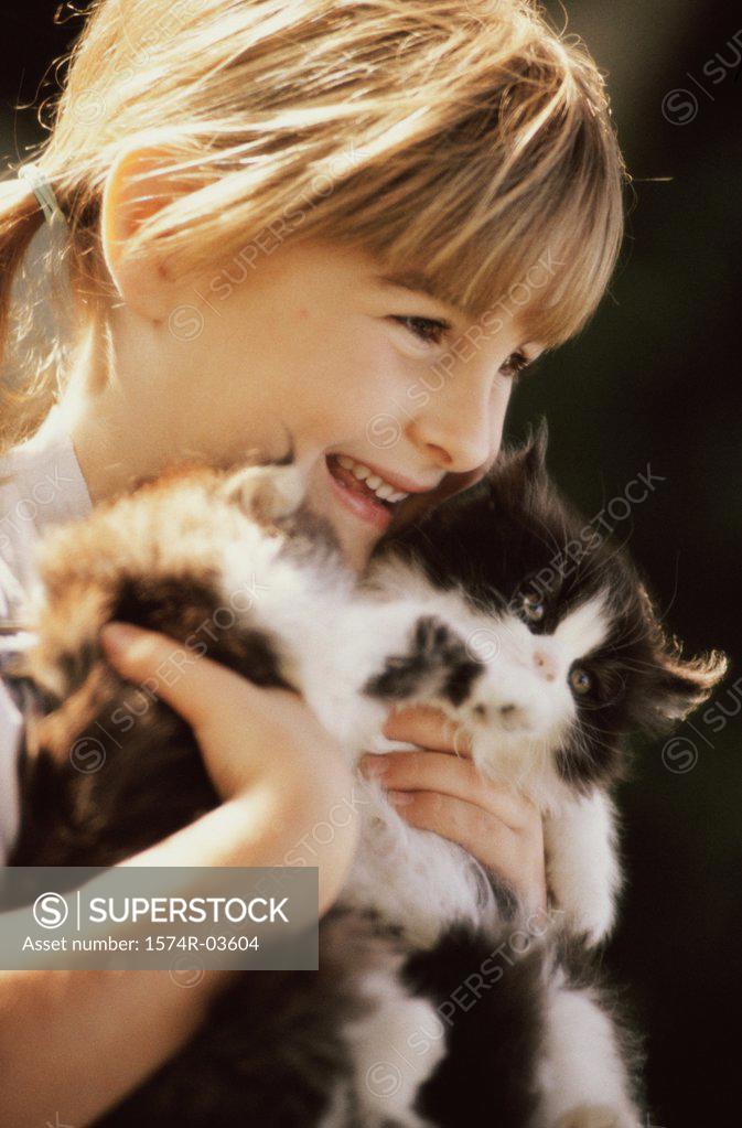 Stock Photo: 1574R-03604 Close-up of a girl holding cats