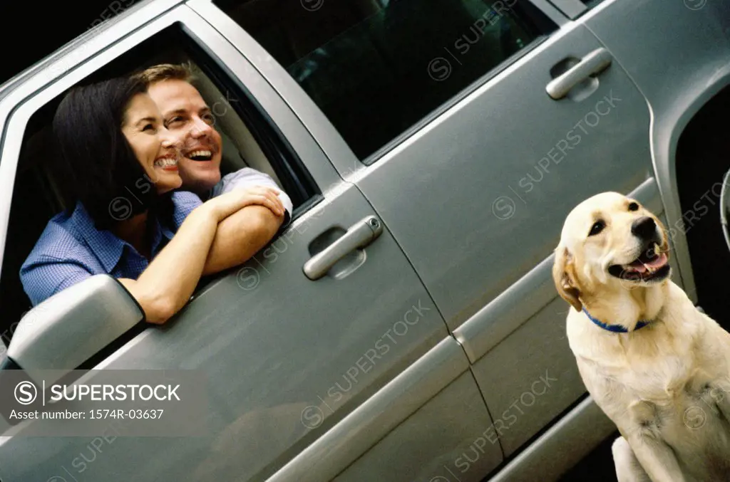 Mid adult couple sitting in a car