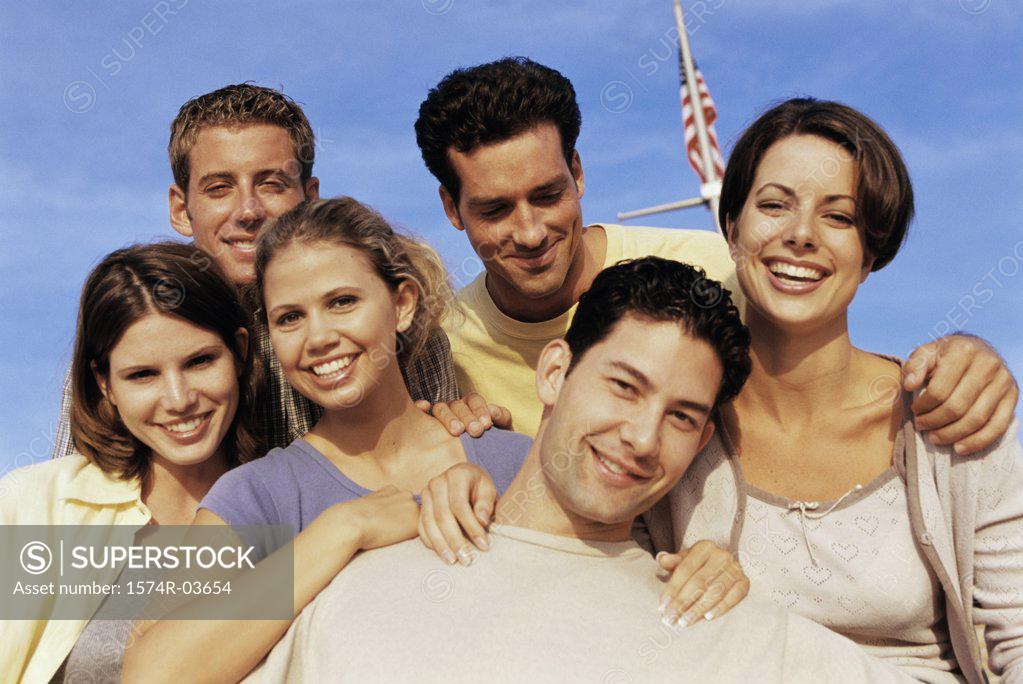 Stock Photo: 1574R-03654 Low angle view of a group of young people smiling