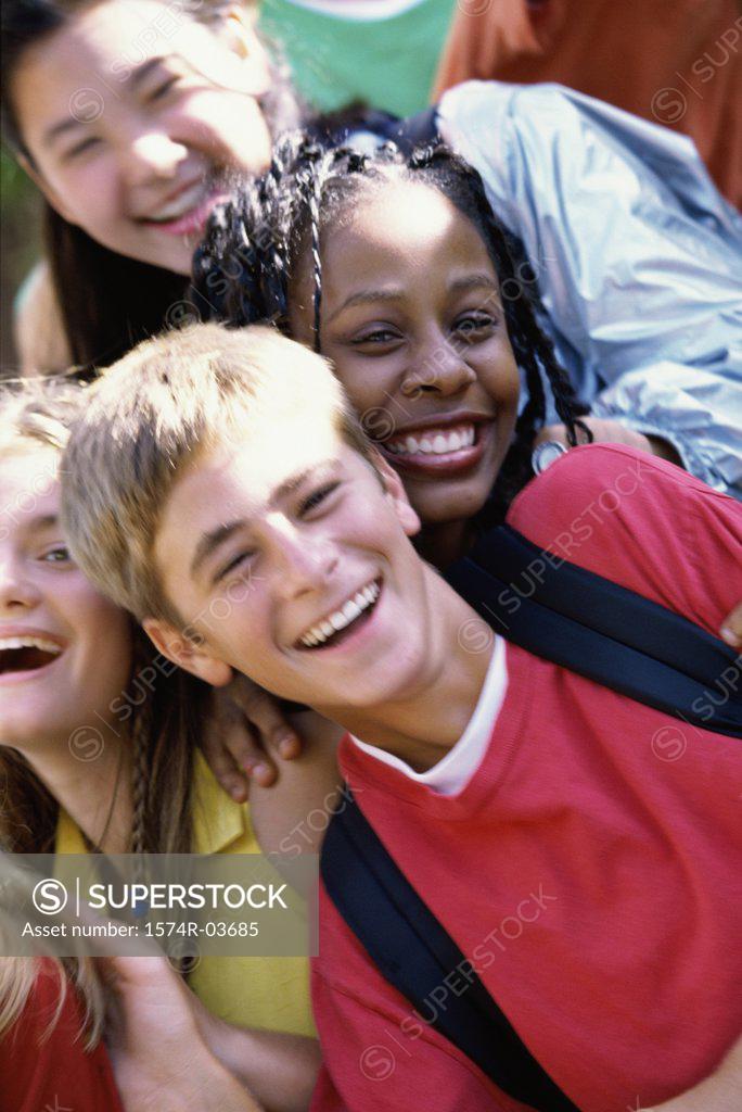 Stock Photo: 1574R-03685 Portrait of a group of teenagers smiling