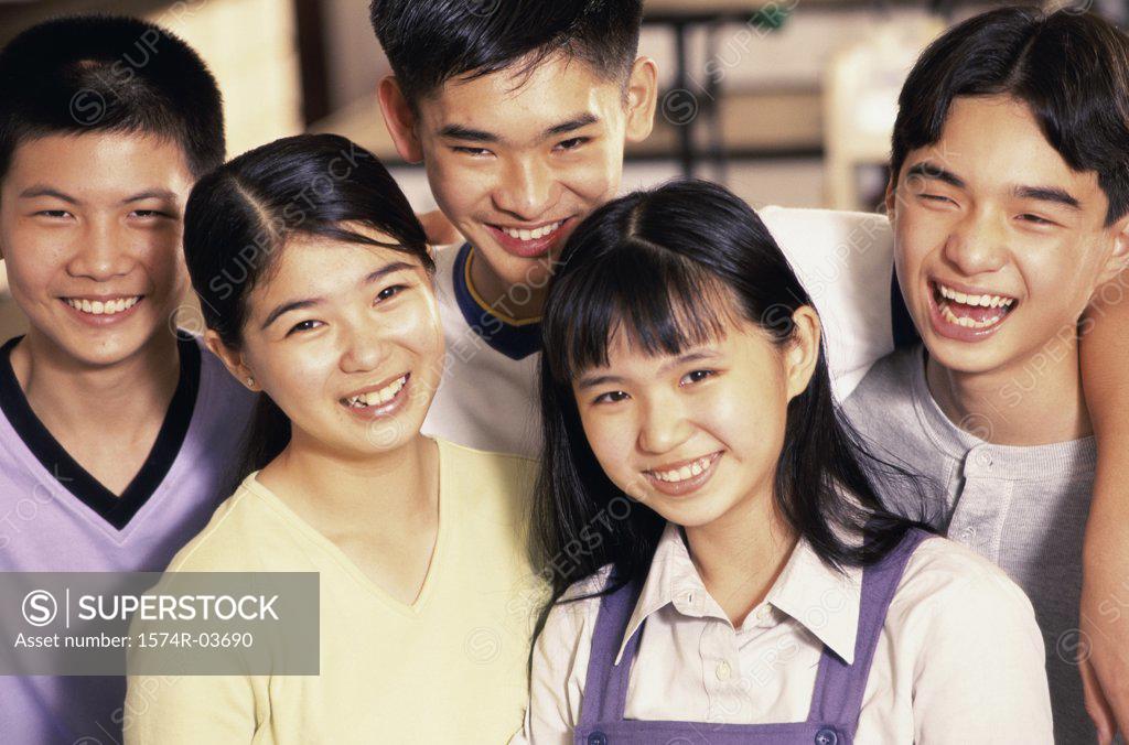 Stock Photo: 1574R-03690 Portrait of a group of teenagers smiling