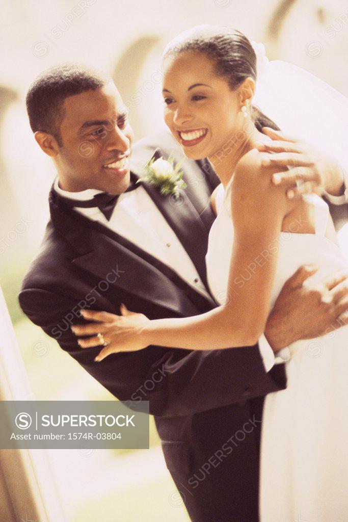 Stock Photo: 1574R-03804 Side profile of a newlywed couple dancing
