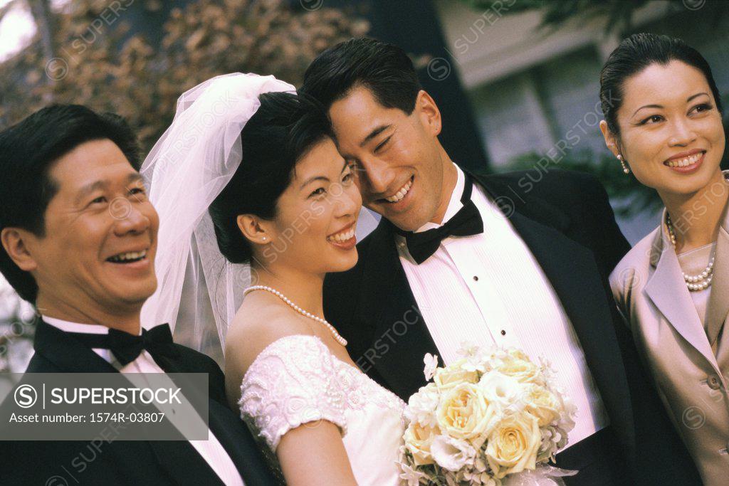 Stock Photo: 1574R-03807 Newlywed couple smiling with their parents