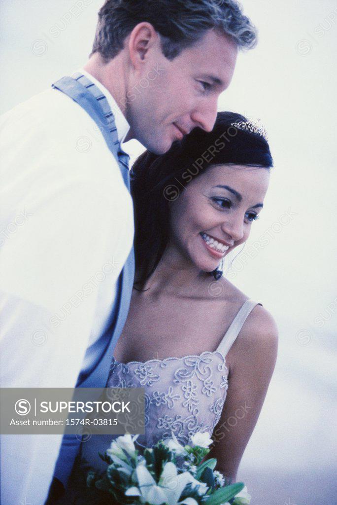 Stock Photo: 1574R-03815 Close-up of a newlywed couple smiling