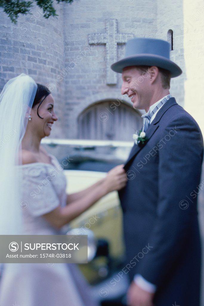 Stock Photo: 1574R-03818 Side profile of a newlywed couple smiling