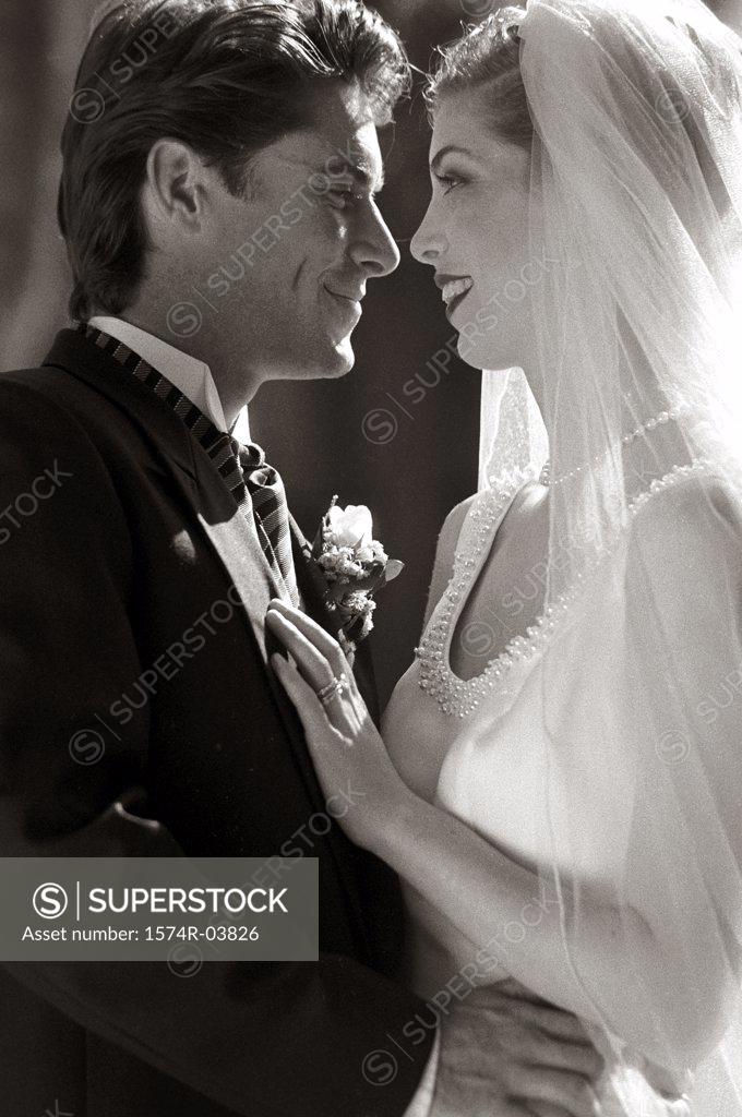Stock Photo: 1574R-03826 Side profile of a newlywed couple looking at each other