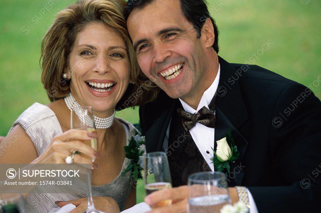 Stock Photo: 1574R-03841 Close-up of a newlywed couple drinking champagne