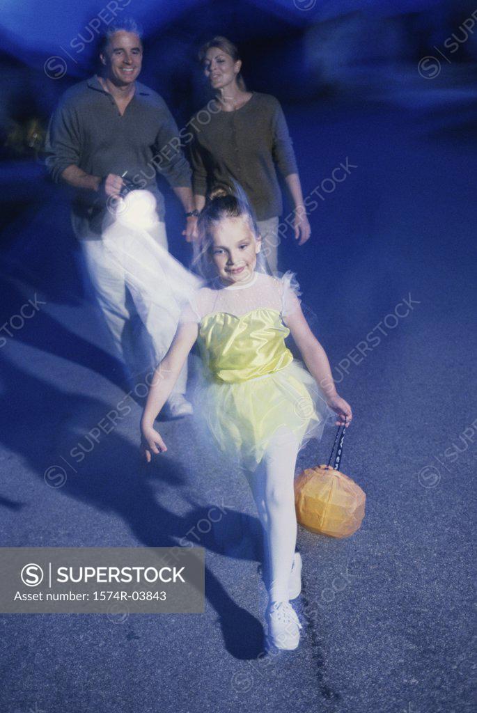 Stock Photo: 1574R-03843 Girl trick or treating at Halloween