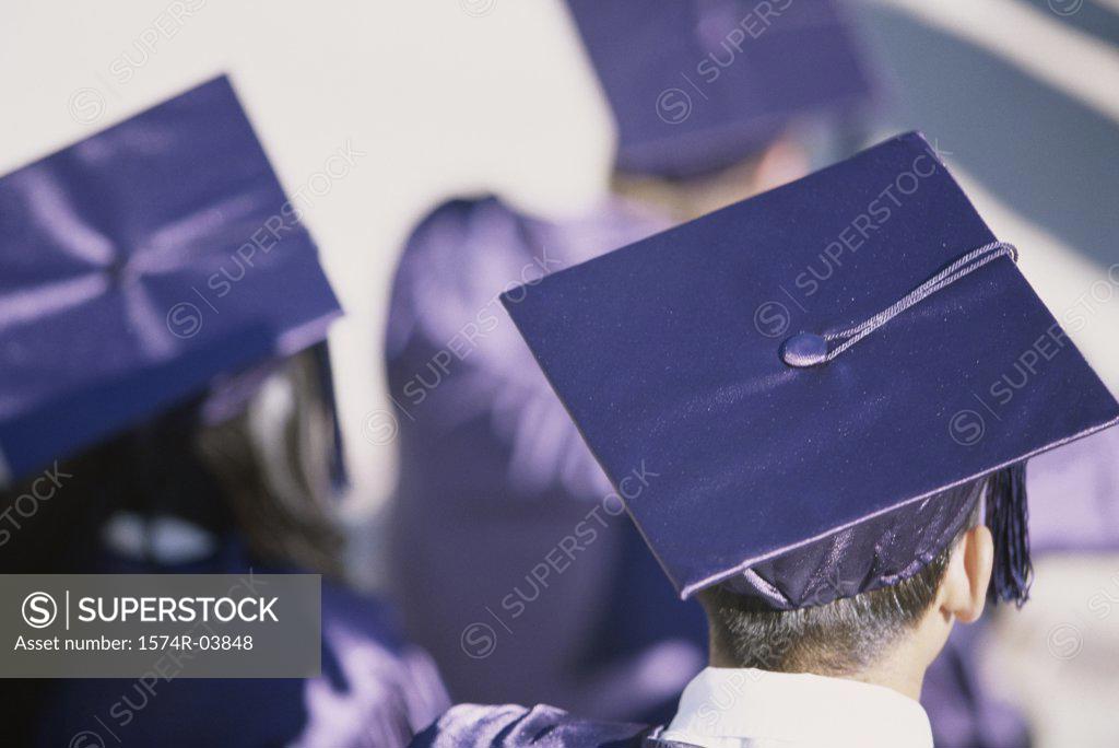 Stock Photo: 1574R-03848 Rear view of young graduates