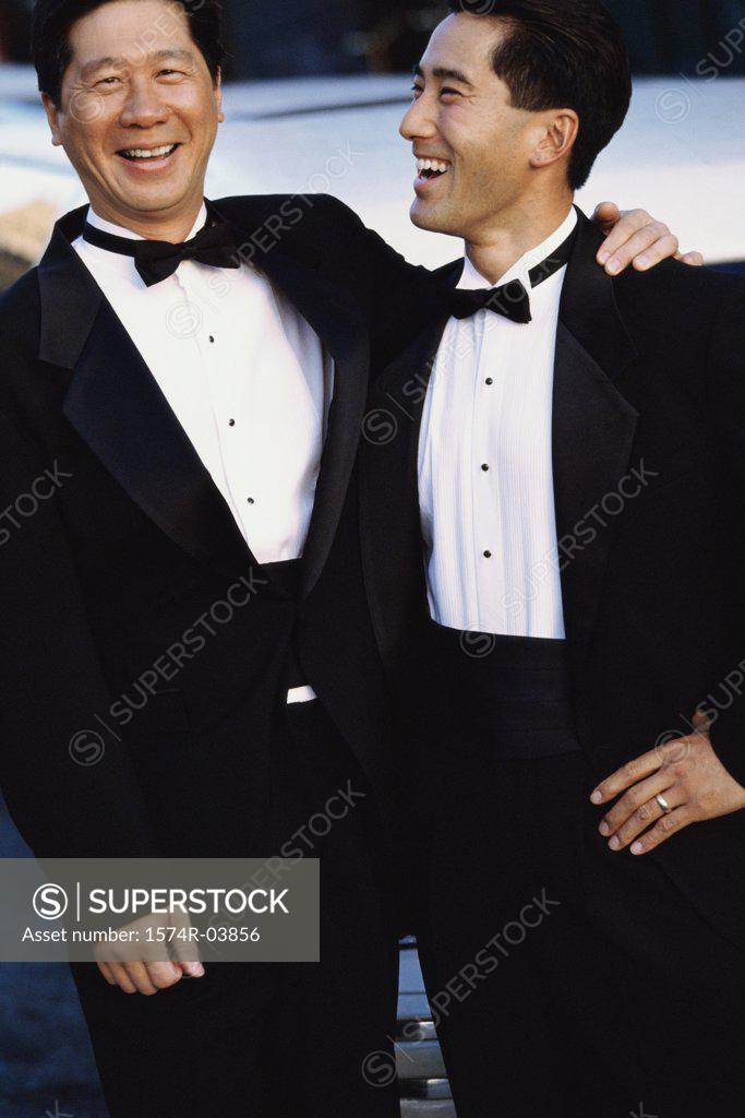 Stock Photo: 1574R-03856 Portrait of a father standing with his son