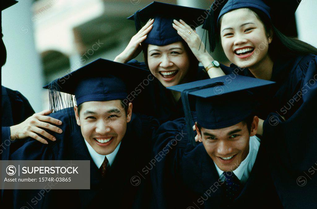 Stock Photo: 1574R-03865 Portrait of a group of college students wearing graduation outfits